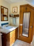 Full bathroom with tub shower combo on first floor